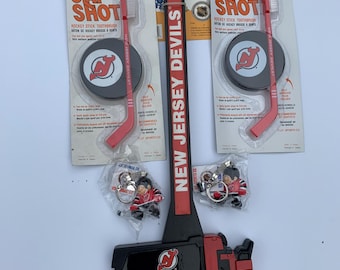 Medias de hockey de los New Jersey Devils: raspador de hielo, cepillos de dientes, llaveros
