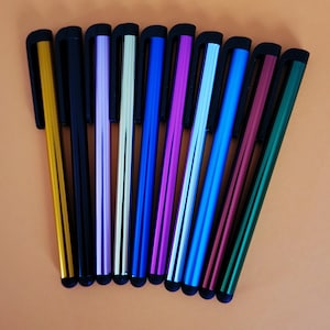 May include: A set of ten stylus pens arranged in a fan shape, each featuring a metallic barrel in colors including gold, black, purple, silver, blue, magenta, light blue, cyan, red, and green, all equipped with a black clip and tip.