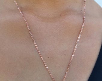Rose gold chain necklace featuring two seashell pendants. Dainty jewelry. Gift for her.