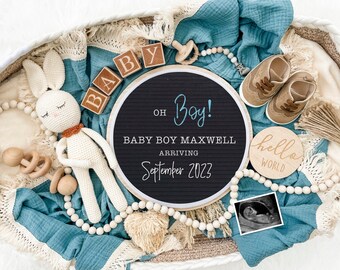 May include: A blue and white baby blanket with a wooden sign that reads "Oh Boy! Baby Boy Maxwell Arriving September 2023". There are also wooden blocks that spell out "Baby", a wooden sign that reads "Hello World", a crocheted bunny, a pair of brown baby shoes, and a sonogram image.