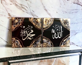 May include: Two square black resin art pieces with gold and silver glitter accents. The Arabic calligraphy "Allah" and "Muhammad" are written in gold on the black background.