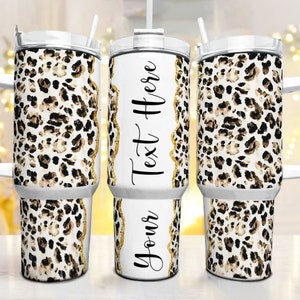 May include: A set of three insulated tumblers with white handles and lids. The tumblers feature a leopard print design in brown and black spots on a white background. One tumbler has the text "Text Here" and "Your Text Here" in black.