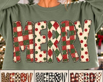 May include: A sage green long-sleeve sweatshirt featuring the word MERRY in large block letters. Each letter has a distinct pattern: red and green plaid, white with red and green polka dots, and a red and green diamond argyle print.