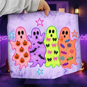 May include: A light purple fabric featuring four ghost illustrations. The first ghost is pink with orange pumpkins, the second is purple with black bats and white spiderwebs, the third is lime green with pink and black bows, and the fourth is orange with colorful candy illustrations. Pink and orange star outlines are scattered across the background.