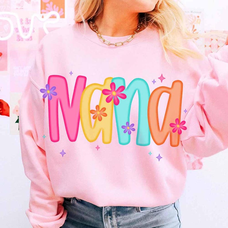 Peut inclure: Sweat-shirt rose avec le mot "Nana" en lettres color&eacute;es avec des fleurs autour des lettres.