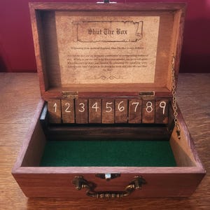 May include: A set of three ceramic vases in varying heights and shapes. The vases are glazed in a matte white finish, offering a minimalist aesthetic. The tallest vase is approximately 10 inches high.