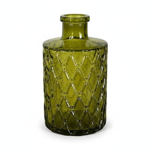 May include: A cylindrical olive green glass vase featuring a raised diamond pattern across its body. The vessel has a narrow neck and a smooth, circular rim. The glass is translucent, allowing light to pass through the textured, geometric surface.