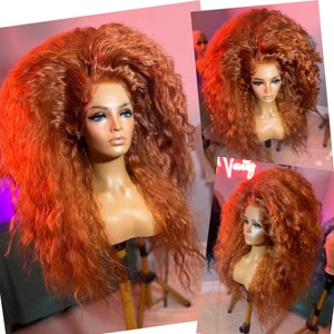 May include: A long, curly, auburn-colored wig on a mannequin head. The wig is styled in a large, voluminous, and dramatic fashion.