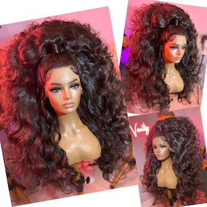 May include: A long, dark brown wig with loose curls styled in a high ponytail. The wig is worn on a mannequin head with a neutral makeup look.