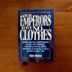 May include: A blue book with the title "Our Emperors Have No Clothes" in white text. The book's subtitle is "Incredibly stupid things corporate executives have done while reengineering, restructuring, downsizing, TQM'ing, team-building, and empowering...in order to cover their ifs, ands or "buts."