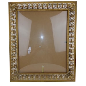 Frame in chiseled and openwork gilded metal and convex glass / antique decoration / antique photography / photo collection / photo framing