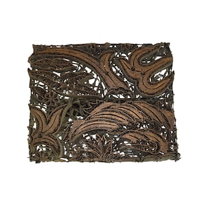 May include: A brown wooden batik printing block with a floral design. The block is made of wood and has a raised design that is used to create patterns on fabric.