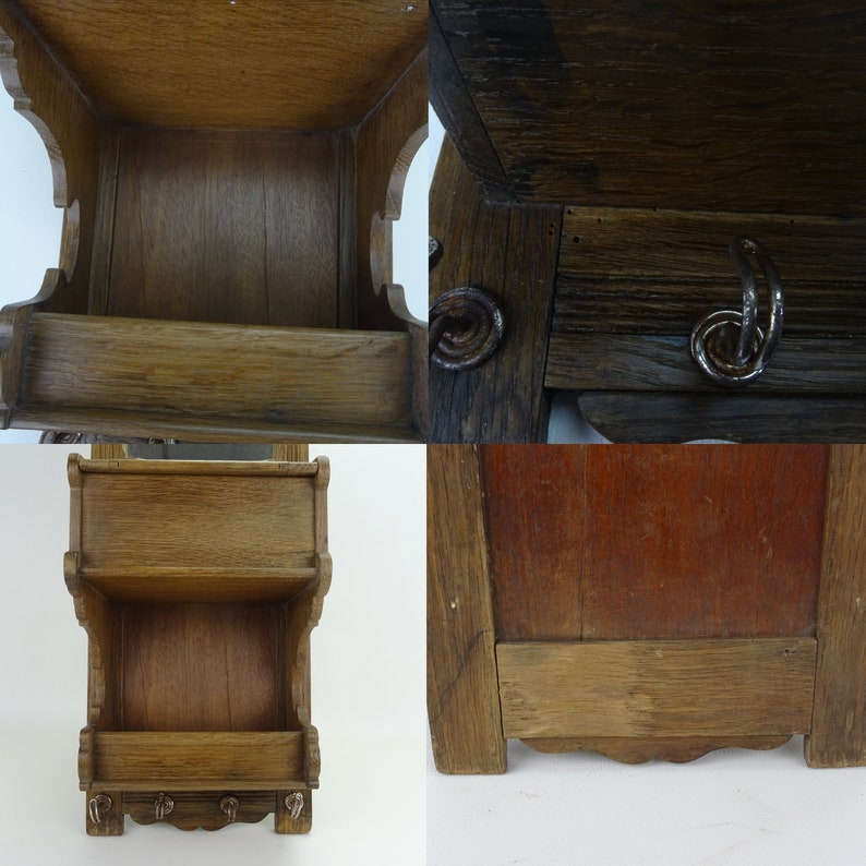 May include: A wooden wall shelf with two shelves and hooks on the bottom. The shelf is made of dark wood and has a rustic look.