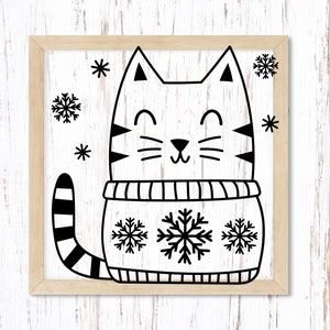 Puede incluir: Ilustraci&oacute;n en blanco y negro de un gato con un su&eacute;ter con copos de nieve. El gato sonr&iacute;e y tiene una cola rayada.