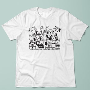 May include: Black and white illustration of a group of dogs of different breeds. The dogs are all standing in a row, and they are all looking at the viewer. The illustration is on a white t-shirt.