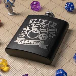May include: Black metal flask with a silver engraved design that says "Elixir of Health +3".
