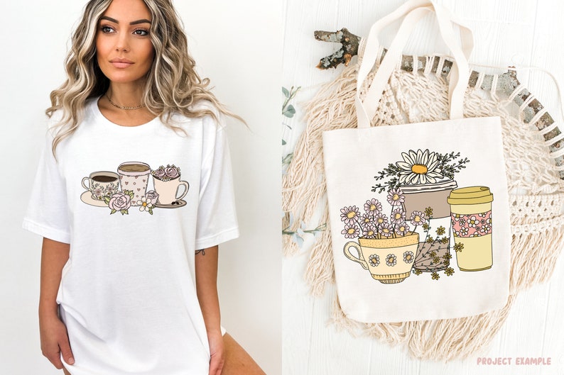 May include: White t-shirt featuring a coffee-themed graphic with cups, flowers, and a spoon. A canvas tote bag displays a similar design with daisies and coffee cups. The design is in soft pastel colors.