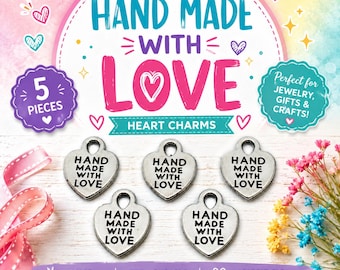 May include: Five silver-toned heart-shaped metal charms, each featuring the embossed text "HAND MADE WITH LOVE" and a small loop at the top for attachment. The charms are arranged in a group against a light background with decorative text.