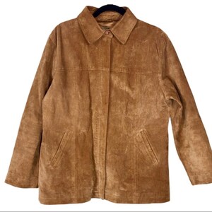 May include: A brown suede jacket with a button-up front and two pockets on the front.