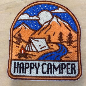 Sew on embroidered patch. Happy camper