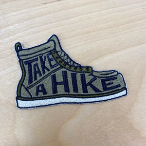 Sew on patch. Take a hike