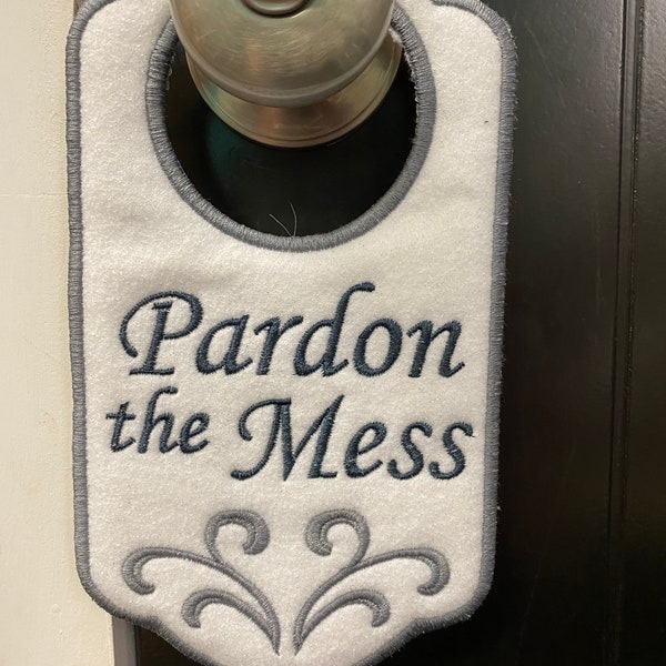 Pardon the mess door hanger