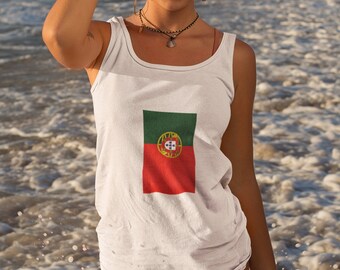 May include: White vest top displaying the Portuguese flag, with green and red sections and a coat of arms. The person is in the ocean, with waves splashing around them. The top has a square neck.