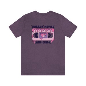 Horror movies and chill tshirt, Halloween tshirt, Pink Halloween shirt,Girly Halloween, Retro Groovy shirt, Scary movie tee, Spooky shirt Heather Team Purple