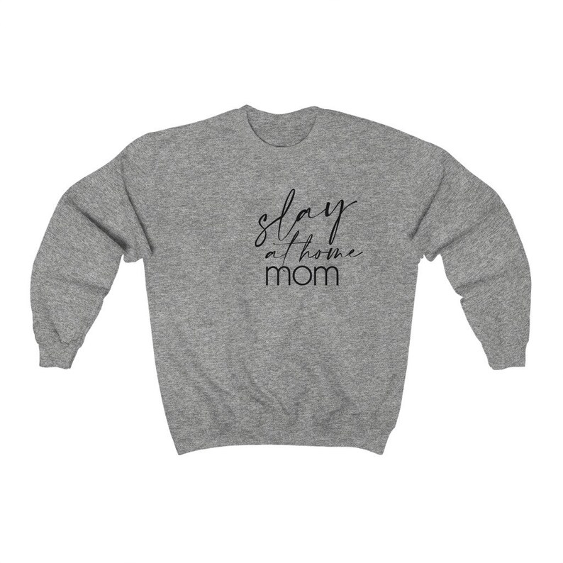 May include: A heather gray sweatshirt with the text "stay at home mom" in black script.