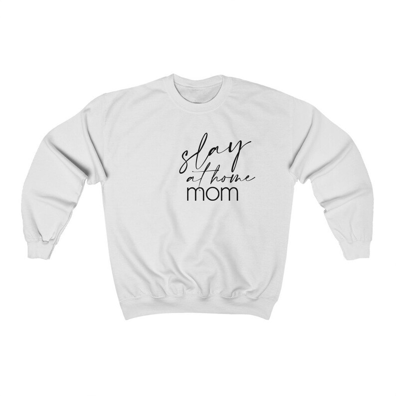 May include: White sweatshirt with black text that reads "slay at home mom".