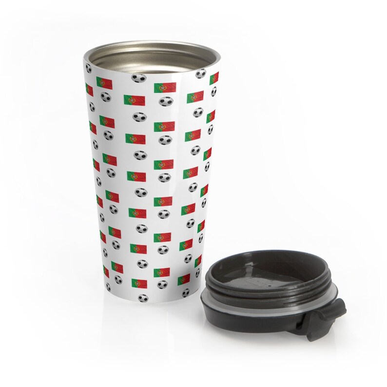 May include: A white stainless steel travel mug with a black lid. The mug has a repeating pattern of soccer balls and the Portuguese flag.