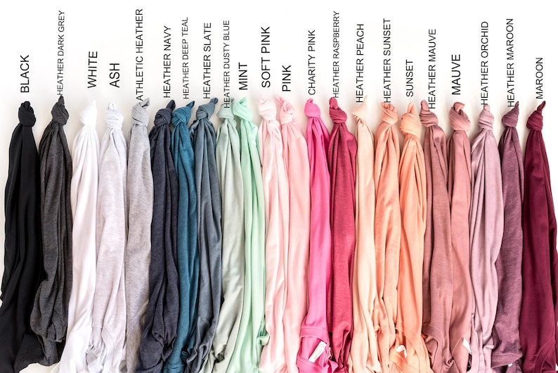 May include: A variety of t-shirt colors, including black, white, ash, heather navy, heather deep teal, heather slate, heather dusty blue, mint, soft pink, pink, charity pink, heather raspberry, heather peach, sunset, heather mauve, mauve, heather orchid, heather maroon, and maroon.