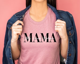 May include: A pink t-shirt with the word "MAMA" in black block letters and the names "Lilly Connor Stephanie" written in white script underneath.