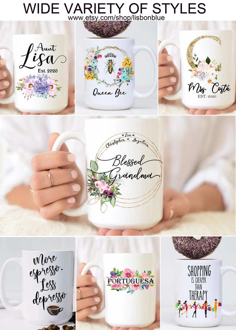 May include: A collection of white ceramic mugs with various designs and text. The mugs feature floral designs, a bee, a moon, and text such as "Aunt Lisa", "Queen Bee", "Mrs. Costa", "Blessed Grandma", "More espresso. Less depresso", "Portuguesa", and "Shopping is cheaper than therapy".