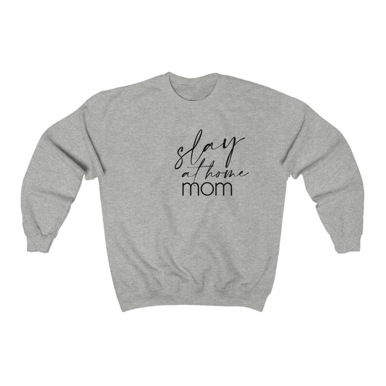 May include: Gray sweatshirt with the text "slay at home mom" in black script.