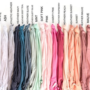 May include: A range of t-shirt colours, including black, white, ash, heather navy, heather deep teal, heather slate, heather dusty blue, mint, soft pink, pink, charity pink, heather raspberry, heather peach, heather sunset, sunset, heather mauve, mauve, heather orchid, heather maroon, and maroon.
