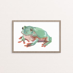 May include: A framed illustration of a green tree frog with orange feet. The frog is sitting on a white background.