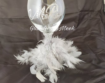 Customized wine glass with bling and feathers
