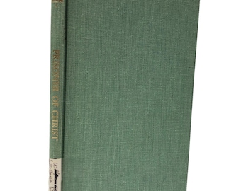 May include: A hardcover book titled "Prisoner of Christ" with a green cover and spine. The spine features gold lettering and a small label with additional text. The book has a textured appearance.