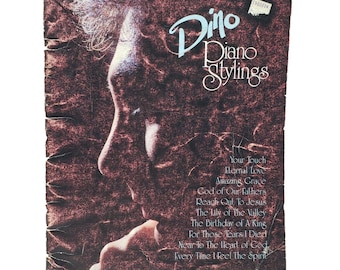May include: Vintage album cover for "Dino Piano Stylings" featuring a profile portrait of a man. The cover is a mix of brown and maroon with the title in elegant script. Song titles like "Your Touch" and "Eternal Love" are listed. The album is from Lexicon Music.