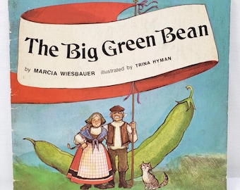 May include: Vintage children's book cover titled "The Big Green Bean" with illustrations by Trina Hyman. The cover features a banner with the title, a couple in traditional clothing, a large green bean, and a cat. The background is a light blue.