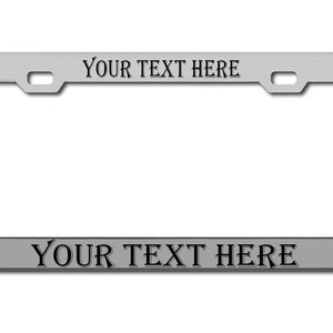 May include: A silver metal license plate frame with the text "YOUR TEXT HERE" on the top and bottom.