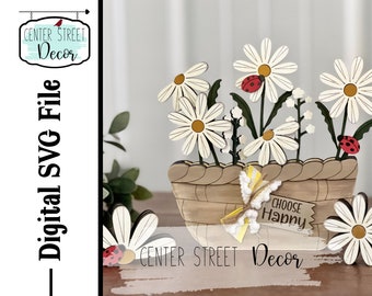 May include: Wooden cutout of a basket of daisies with ladybugs and a sign that says "Choose Happy". Center Street Decor is written on the sign.