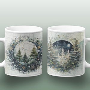 May include: Two white ceramic mugs with a winter forest scene. One mug features a wreath of pine branches and stars surrounding a moonlit forest. The other mug shows a moonlit forest with a crescent moon and stars in the sky.