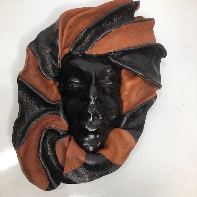 Vintage molded leather face mask created in Haiti