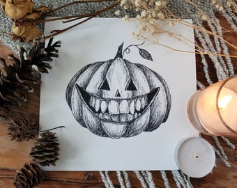 May include: Black and white illustration of a grinning jack-o'-lantern. The pumpkin has triangular eyes and a wide, toothy smile. The artwork is on a white square, surrounded by decorative elements like pinecones and a lit candle.