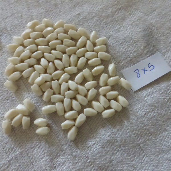 lot de 100 perles anciennes émaux de briare forme dent de lait couleur ivoire