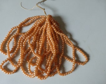 lot of 700 very old French beads Briare beads in pearly salmon glass on original threads