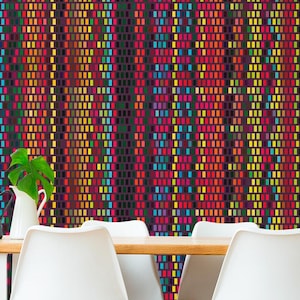 May include: A dining room scene featuring a wooden table with white legs and six white chairs. The wall behind the table has a colorful, patterned wallpaper. Decorative items include plants and candles.