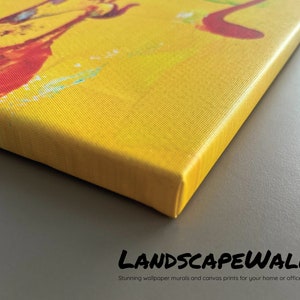 May include: Close-up of a canvas print with a vibrant abstract design in yellow, red, and blue hues. The canvas is stretched over a wooden frame. The text "LANDSCAPEWALLS" and "Stunning wallpaper murals and canvas prints for your home or office" are visible.